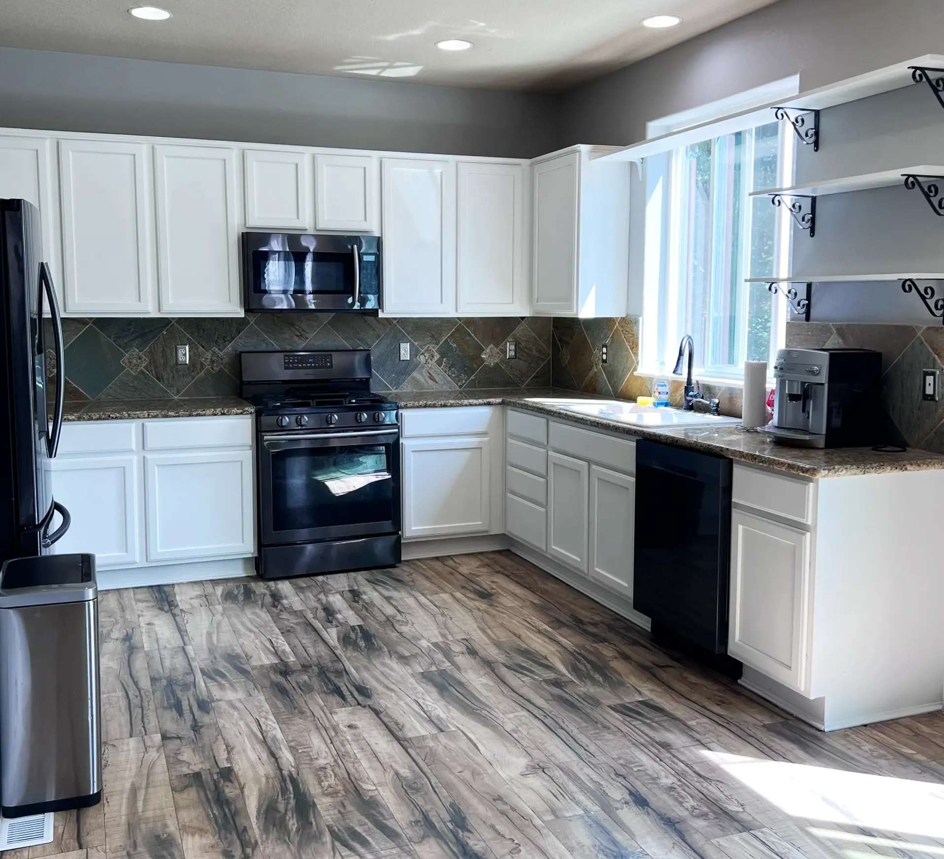 Kitchen remodeling project with white cabinets and updated finishes