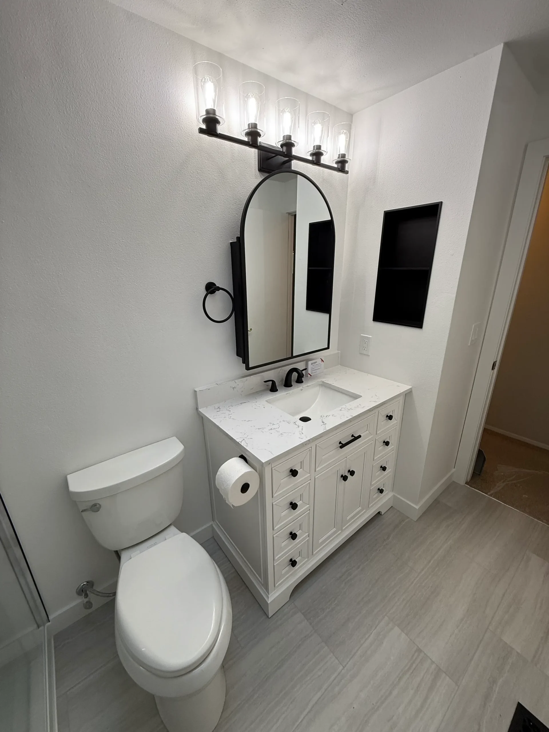 Bathroom remodeling project with updated shower and interior finishes