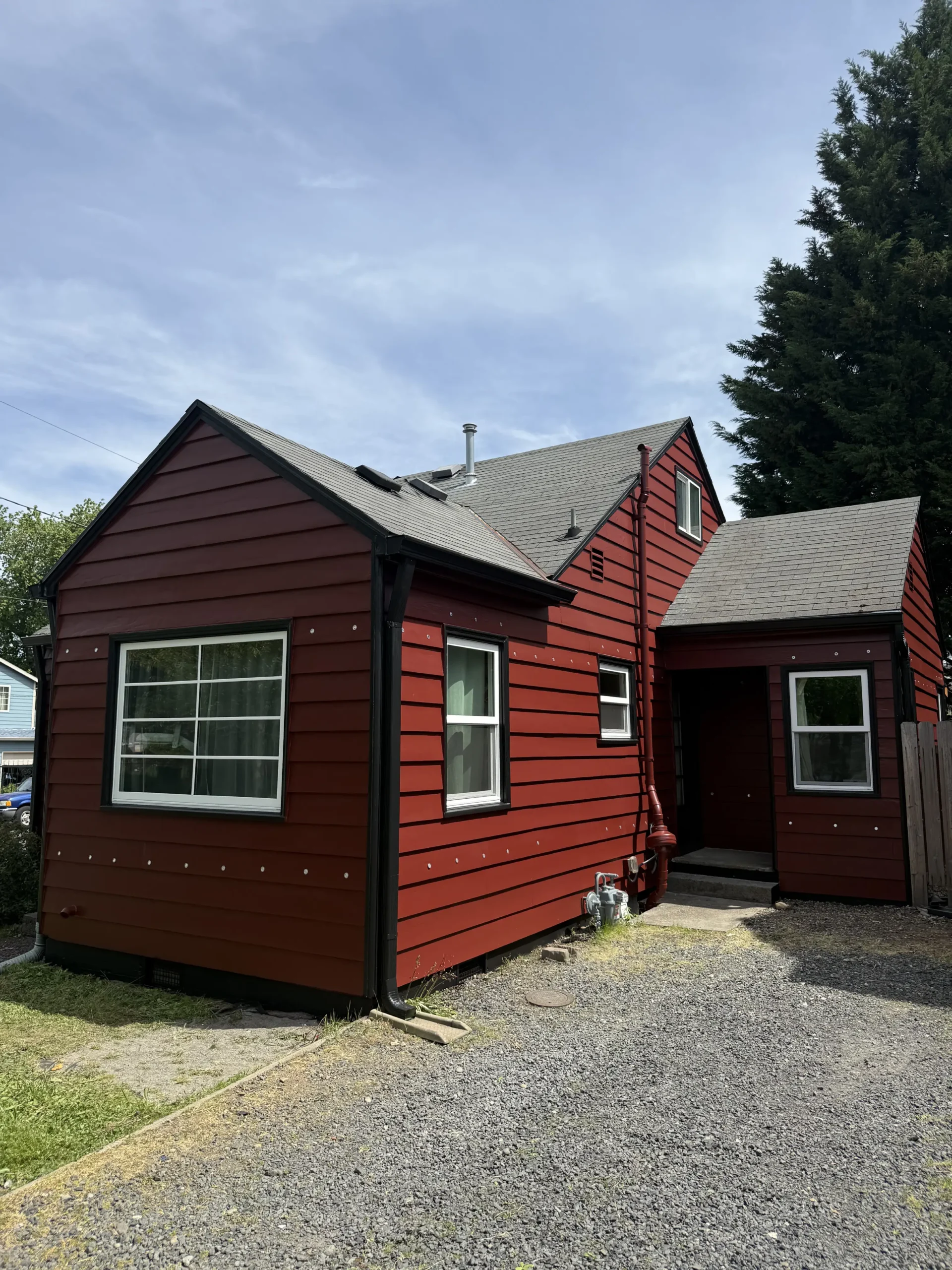 Residential house painting project featuring refreshed exterior surfaces